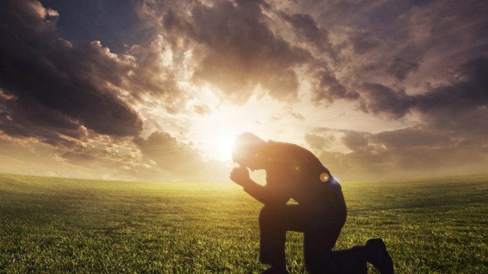 Praying at sunset